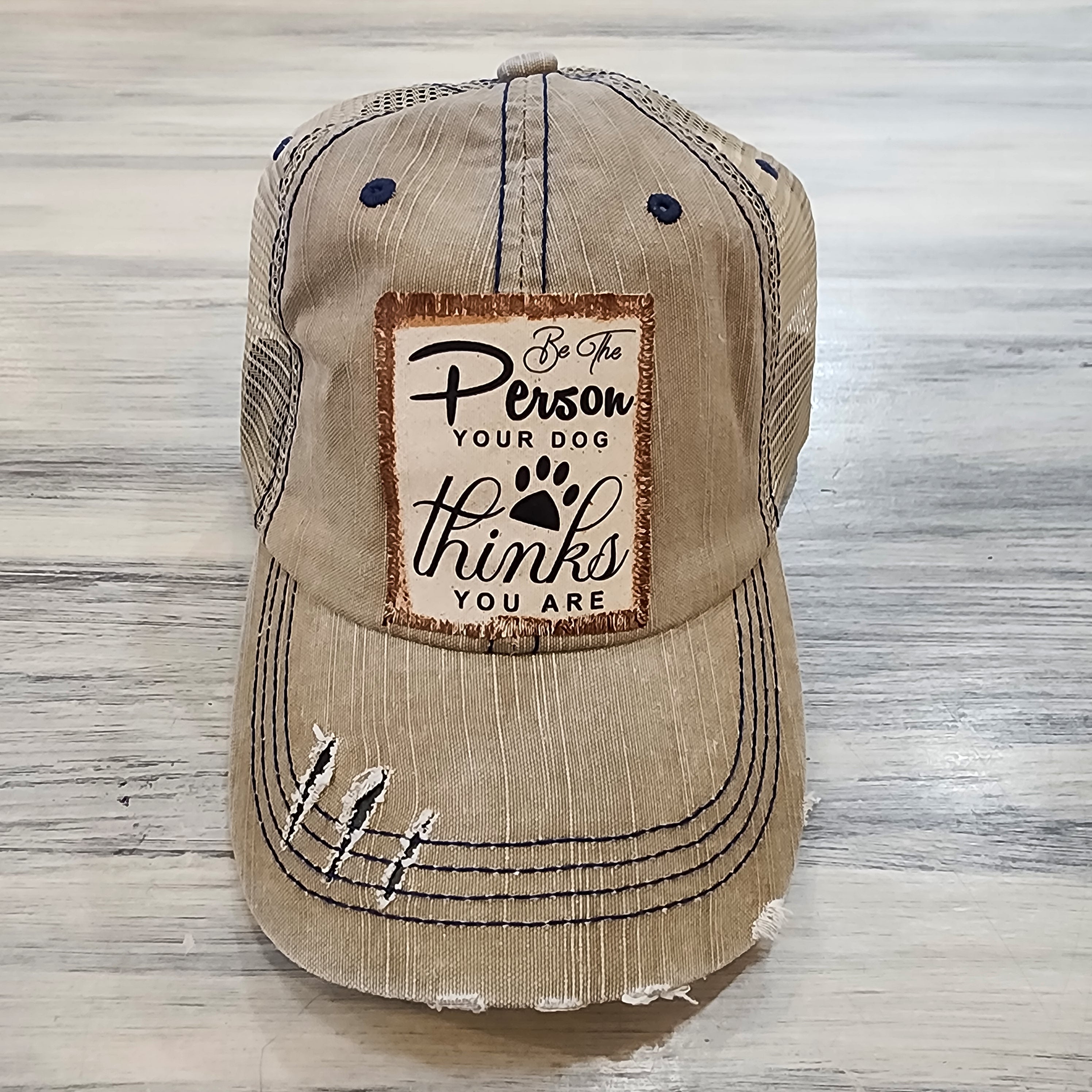Be the Person Your Dog Thinks You Are Distressed Trucker Hat