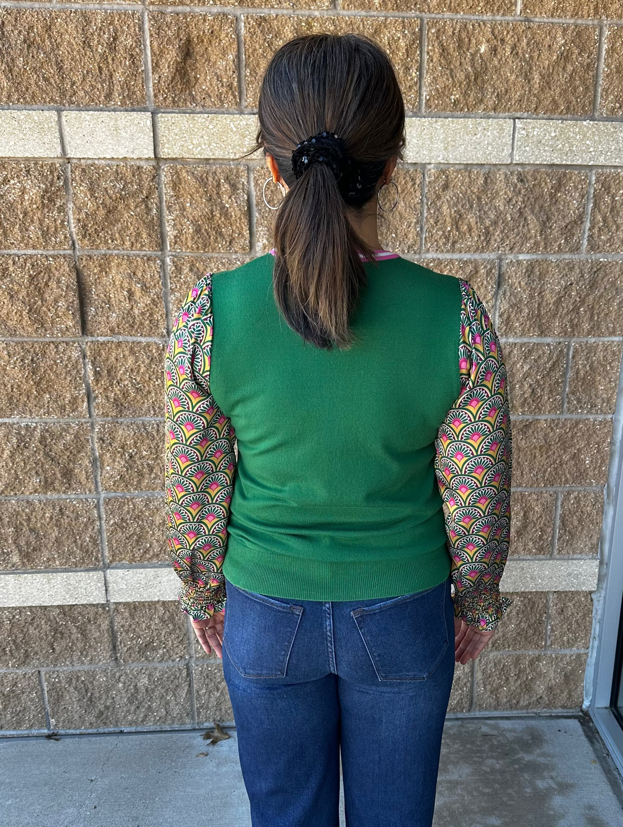 green sweater with contrast sleeves