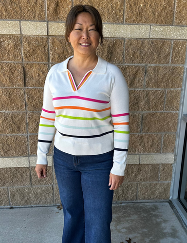 White sweater with bright colored stripes