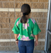 green blouse with floral print and bubble hem