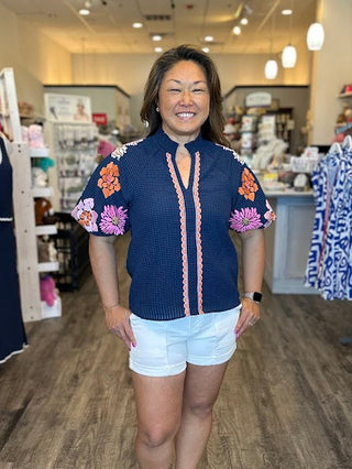 Navy Top with floral embroidery and puff sleeves